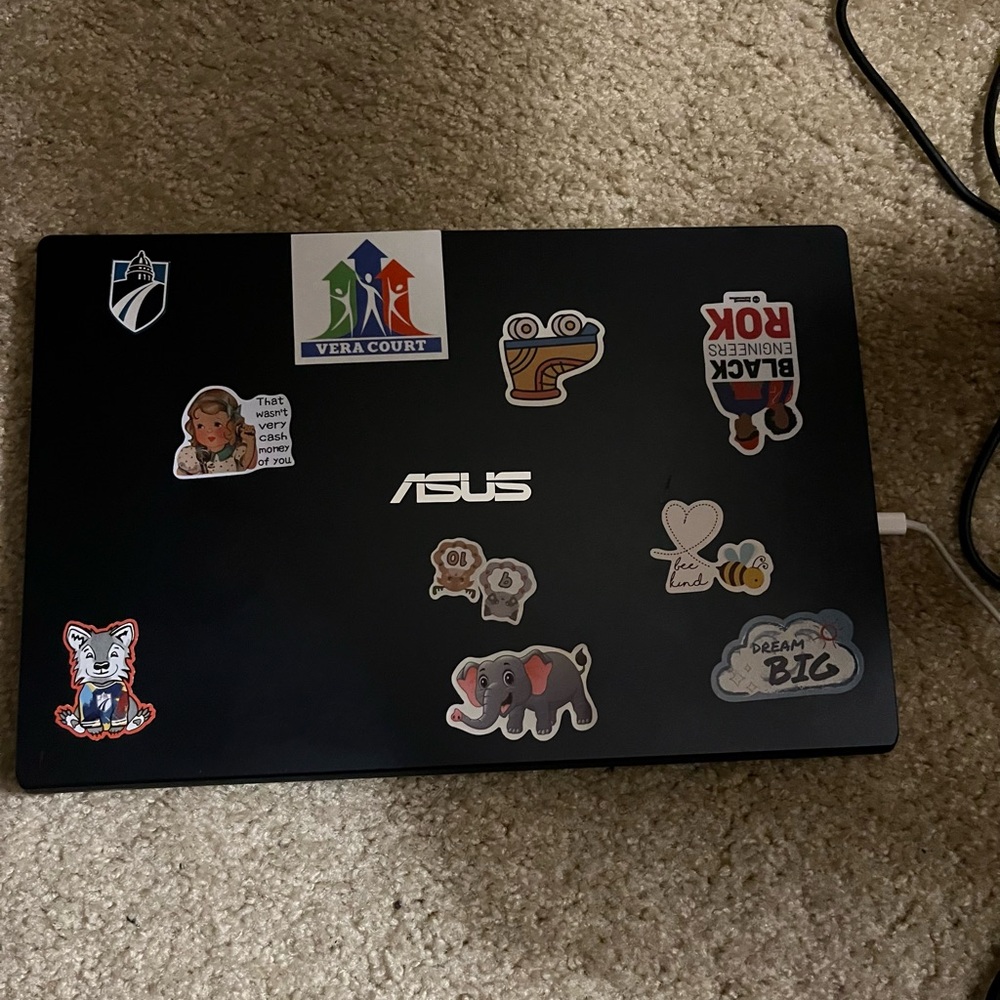 ASUS Black Laptop with Stickers